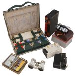 A 1930s travelling bridge case, opera glass, miniature Zuiho Field binoculars and playing cards