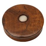 An early 19th century turned oak snuff box