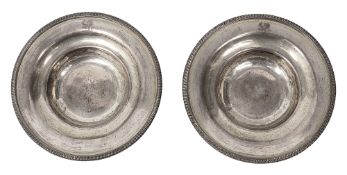 A pair of George III silver counter dishes