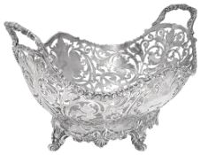 An Edwardian silver twin handled pierced basket