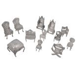 Early 20th century mostly Dutch novelty silver miniature furniture