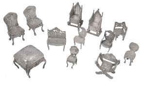 Early 20th century mostly Dutch novelty silver miniature furniture