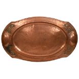 An Arts and Crafts hammered copper tray