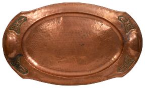 An Arts and Crafts hammered copper tray