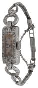 An Art Deco lady's diamond-set platinum evening wrist watch
