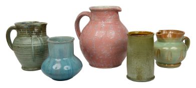 A William Fishley Holland pottery jug and four further pottery pieces.