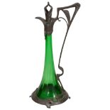 An Art Nouveau continental pewter and green glass claret jug c.1900