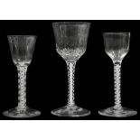 Three mid 18th century opaque twist stemmed wine glasses