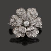 A diamond-set floral brooch,