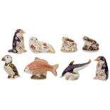 A collection of eight Royal Crown Derby paperweights