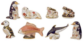 A collection of eight Royal Crown Derby paperweights