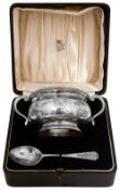 A cased George VI silver twin handled porringer and spoon