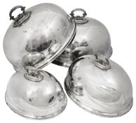 Four Edwardian graduated silver plated meat domes