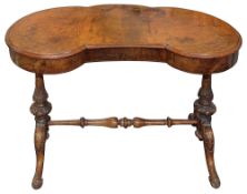A Victorian walnut kidney shaped dressing table