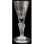 An early 18th century moulded stem wine glass c.1720