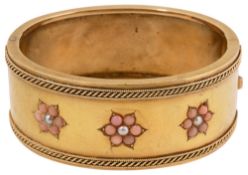 A Victorian yellow gold, coral and seed pearl hinged bangle