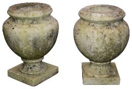 A near pair of French marble urns