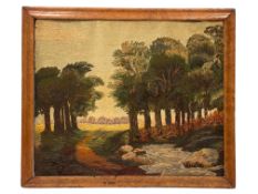 A woolwork landscape of a wooded scene