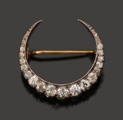 A late Victorian diamond-set crescent brooch,