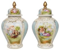 A pair of German Schierholz porcelain vases and covers