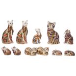 A collection of eleven Royal Crown Derby Cat paperweights