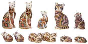 A collection of eleven Royal Crown Derby Cat paperweights