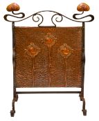 An Arts & Crafts wrought iron and copper firescreen