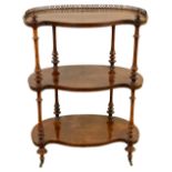 A Victorian figured walnut three tier etagere