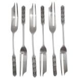 A set of six silver pastry forks designed by Bernard Cuzner