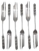 A set of six silver pastry forks designed by Bernard Cuzner