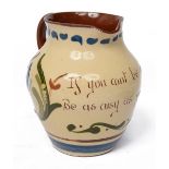 An early 20th century Longpark Torquay pottery mottoware jug