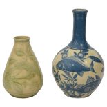 A C.H. Brannam pottery vase and another Brannam example
