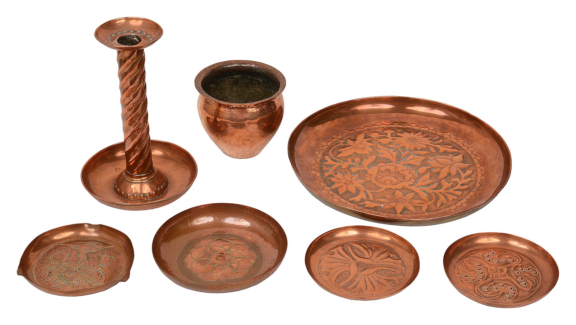 Arts & Crafts hammered copper dishes, a candlestick and a cache pot