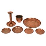 Arts & Crafts hammered copper dishes, a candlestick and a cache pot