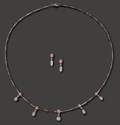 A diamond and pink sapphire necklace and a pair of matching earrings