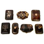 A group of seven tortoiseshell and pique work purses