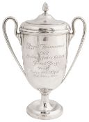 A George V silver twin handled trophy and cover