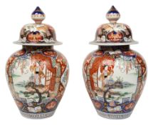 A pair of 19th century Japanese Imari jars and covers