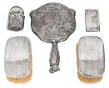 A silver hand mirror, a card case and other items