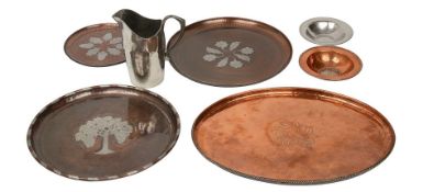 Seven pieces of Arts and Crafts hammered copper and pewter