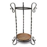 An Arts and Crafts wrought iron and copper stick / umbrella stand