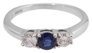 A sapphire and diamond three stone ring,