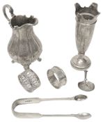 A silver cream jug, a spill vase and other silver