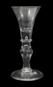 A mid 18th century light baluster wine glass c.1740