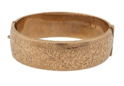 A 9ct gold hinged bangle