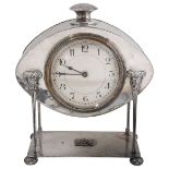 An Arts and Crafts planished silver plated desk clock