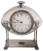 An Arts and Crafts planished silver plated desk clock