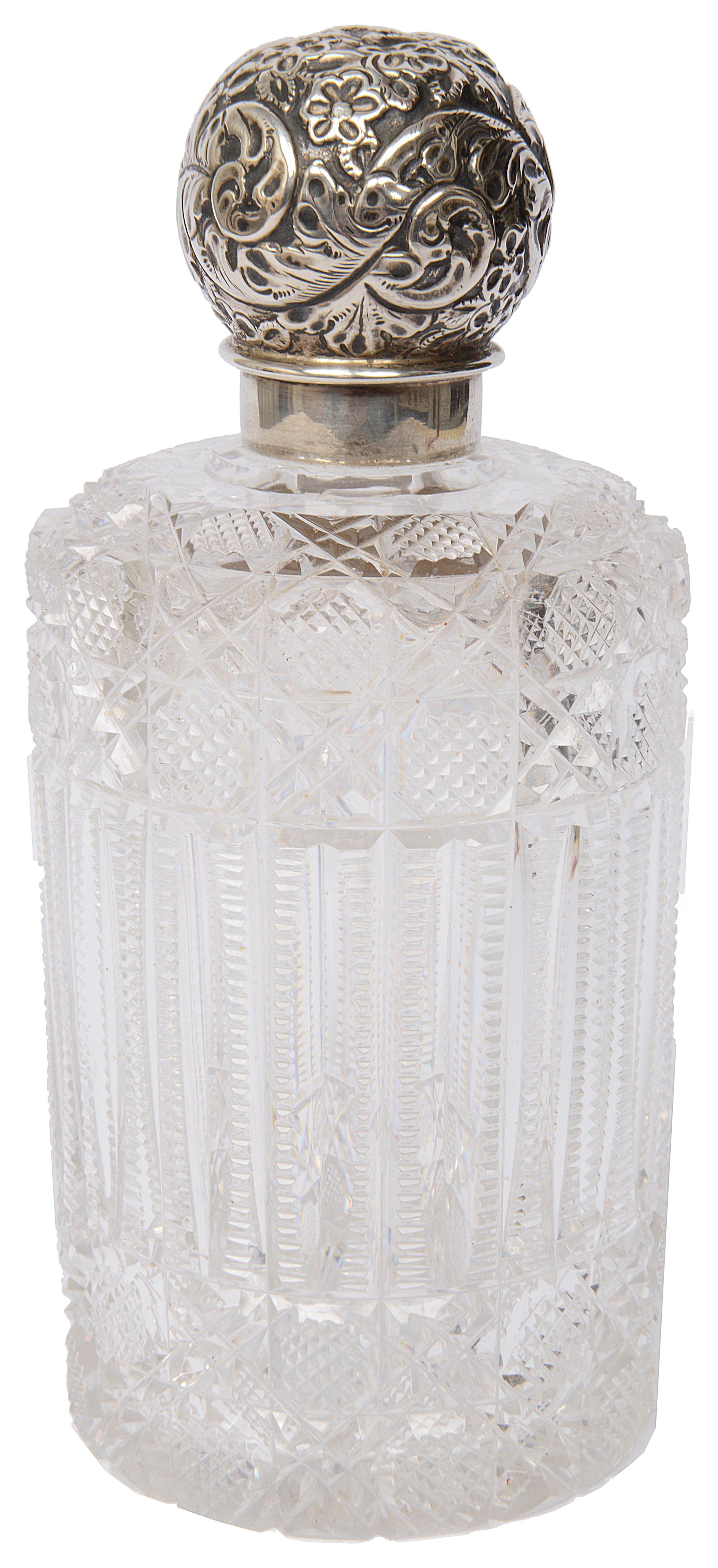 An Edwardian silver topped glass perfume bottle