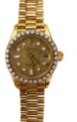 A lady's 18K yellow gold and diamond Rolex Oyster Watch