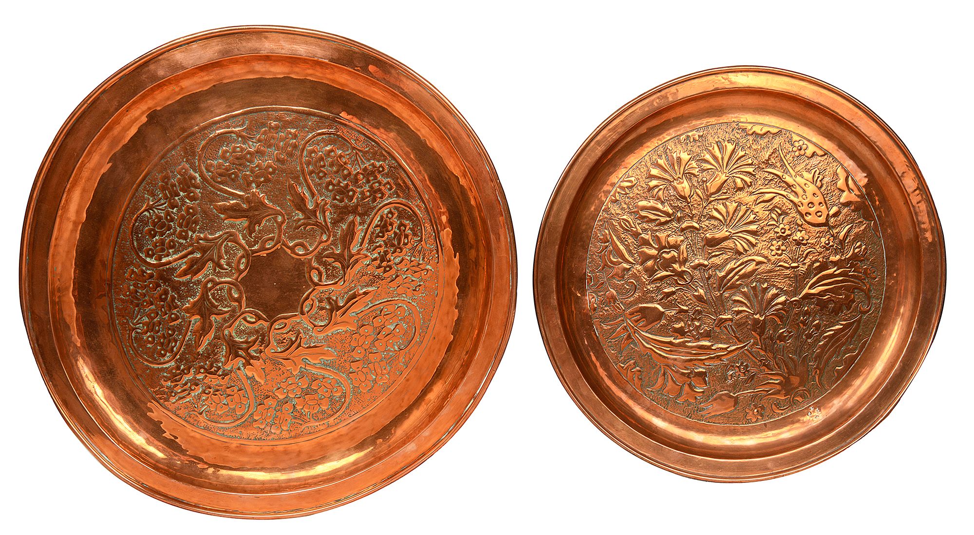 Two graduated Arts & Crafts circular hammered copper trays